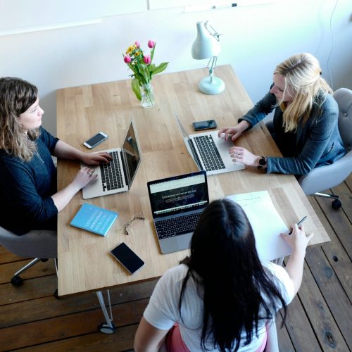 Financial services referral partner collaboration — professionals discussing partnership opportunities