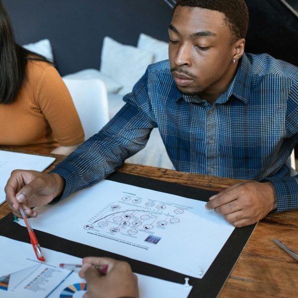 Business team engaged in analyzing graphs during a professional meeting at the office.